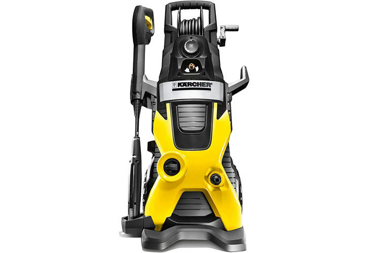 High-pressure washer in action cleaning a driveway