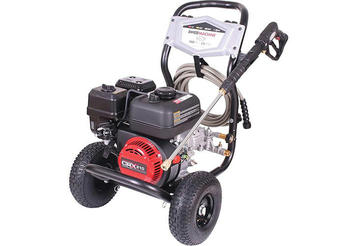 High-pressure washer in action cleaning a driveway